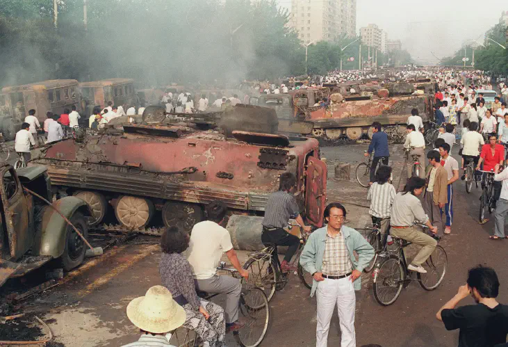 armored personnel carriers burned by demonstrators