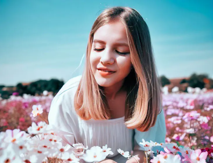 a girl in colorful flowers field